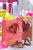 Kraft paper gift bags decorated with paper hearts