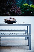 Table and benches on tiled terrace