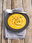 Cream of pumpkin soup with red lentils, chilli and mint