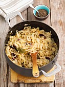 Braised white cabbage with mushrooms and sausage