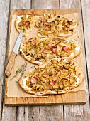 Tarte flambée with white cabbage, onions and Pancetta