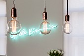 Row of pendant lamps with decorative, vintage-style light bulbs