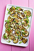 Grilled aubergine slices with tahini and a yoghurt dressing