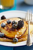 Buttermilk pancakes with berries and maple syrup