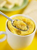 Cornbread on a spoon and in a cup (Mexico)
