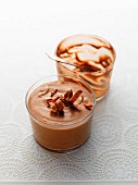 Mousse au chocolat, one full glass and one empty glass