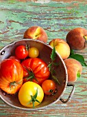 An arrangement of peaches and tomatoes