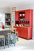 Red dresser in kitchen