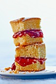A stack of cake slices with strawberry jam