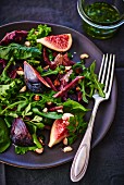Spinach and rocket salad with figs, duck and nuts