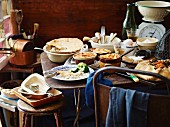 Various winter pies, ingredients and baking utensils on a rustic metal table