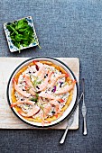 Seafood pie with red onions, caviar and dill