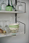 Glasses and bowls on 60s String shelving mounted on wall