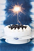 A marzipan cake with blueberries and vanilla cream