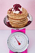 Wholemeal pancakes with cardamom, cream and pomegranate seeds