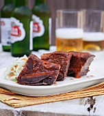 Cola-marinated beef with coleslaw and beer