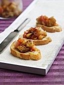 Crostini with aubergines, onions and tomatoes