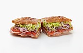 Ham, tomatoes, red onions and lettuce sandwiche