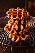 A stack of waffles on a wire rack