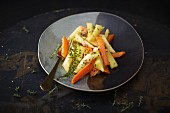 A side of vegetables with carrots and parsnips