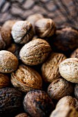 Four walnuts in a basket (close-up)