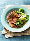 Braised beef brisket with coriander and bok choy