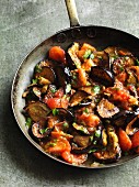 Stir-fried aubergines with tomatoes