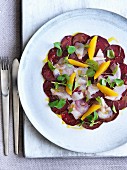 Beetroot carpaccio with sea bass and oranges