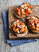 Greek toast with beans, feta cheese and tomatoes