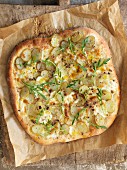 Potato pizza with rocket, mozzarella and porcini mushroom salad