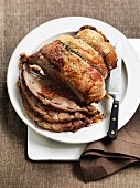 Slow roasted shoulder of lamb with a fennel and sausage stuffing