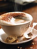 A steaming cappuccino with milk foam