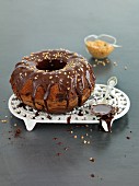 Marble cake with chocolate glaze and nuts