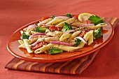 Penne with chicken, broccoli and red onions