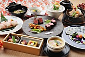 Traditional Japanese dishes: sushi, beef, Tempura and mussels