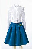 A white blouse and a blue circle skirt