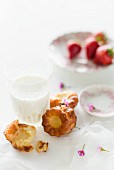 Caneles with milk and strawberries