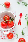 Red vine tomatoes in a colander