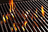 A barbecue rack over burning coals