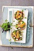 Pear and hazelnut tartlets with a herb topping
