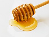 Honey with a wooden spoon (close-up)