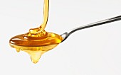 Spoon full of honey, close up