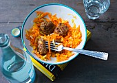 Carrot salad with apple and meatballs