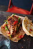 An escalope roll with grilled turkey, tomatoes and beans