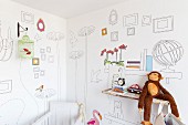 Wallpaper with pattern of line drawings in child's bedroom with monkey soft toy on rustic wooden shelf