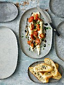 White bean puree with roasted pear tomatoes, garlic, balsamic vinegar and parsley served with toasted baguette.