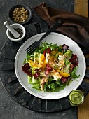 Winter salad with radicchio, shrimps, oranges, pepper and a Dijon mustard dressing