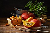 An autumnal arrangement featuring pumpkins, chanterelle mushrooms, onions, potatoes, parsley and salt