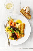 Sheatfish with beetroot, yellow beets, carrots, herbs, oranges and pesto