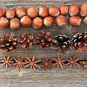 An autumnal arrangement of nuts, pine cones and star anise